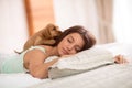 Puppy in bed wake up his mistress Royalty Free Stock Photo