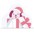 Puppy in a Christmas gift box wearing a Santa hat Royalty Free Stock Photo