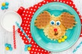 Puppy dog waffles for baby breakfast. Animal-shaped adorable art