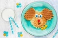 Puppy dog waffles for baby breakfast. Animal-shaped adorable art