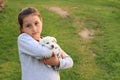 Puppy holded in kids hands Royalty Free Stock Photo