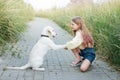 Puppy labrador retriever and little girl Royalty Free Stock Photo