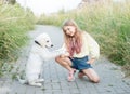 Puppy labrador retriever and little girl Royalty Free Stock Photo