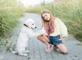 Puppy labrador retriever and little girl Royalty Free Stock Photo