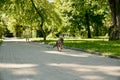 Puppy running away from happy boy at park Royalty Free Stock Photo