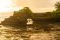 Pura Batu Bolong an iconic Hinduism sea temple nearly Tanah Lot temple in Bali island of Indonesia at evening.