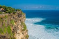 Pura Luhur Uluwatu temple, Bali, Indonesia. Amazing landscape - cliff with blue sky and sea Royalty Free Stock Photo