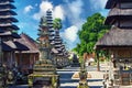 Pura Taman Ayun Temple, Bali - Beautiful holy Hindu temple square with traditional meru towers, multiple thatched roofs , blue