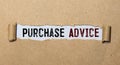 Purchase Advice. Text on white paper on torn paper Royalty Free Stock Photo