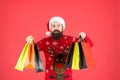 Purchase at any shop at mall. Bearded man carry paperbags with purchase. Purchase order. New year shopping blowout