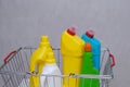 Purchase of household chemicals. Plastic bottles of household chemicals in the shopping basket