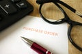 Purchase order, pen, calculator and glasses Royalty Free Stock Photo