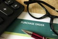 Purchase order, pen, calculator and glasses Royalty Free Stock Photo