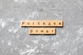 Purchase power word written on wood block. Purchase power text on cement table for your desing, concept Royalty Free Stock Photo