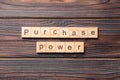 Purchase power word written on wood block. Purchase power text on cement table for your desing, concept Royalty Free Stock Photo