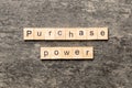 Purchase power word written on wood block. Purchase power text on cement table for your desing, concept Royalty Free Stock Photo