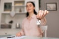 Purchase of real estate. Realtor shows keys. Close-up of hand and documents. Concept of leasing and mortgage Royalty Free Stock Photo