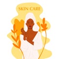 Pure beauty. Beautiful young Afro-American shirtless woman. Women in big leaves. Concept organic natural cosmetics cream