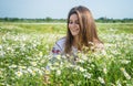 pure beauty. happy girl in chamomile flowers. summer vacation and holiday. pretty woman relax in chamomile field. enjoy Royalty Free Stock Photo