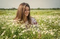 pure beauty. happy girl in chamomile flowers. summer vacation and holiday. pretty woman relax in chamomile field. enjoy Royalty Free Stock Photo