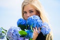 Pure beauty. Tenderness of young skin. Springtime bloom. Girl tender blonde hold hydrangea flowers bouquet. Natural Royalty Free Stock Photo