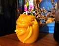 Natural handcrafted beeswax candle. Beewax candle baby dragon in egg. Mythology creature.