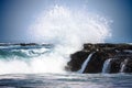 Pure Blue Waters Of California's Pacific Ocean, Coastal Waves Breaking And Splashing On Sea Coast Rocks Encrusted With Mussels