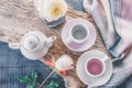 Pure coffee or tea set. A pair of elegant porcelain light gray and pastel pink cups on a cozy background