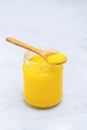 Pure desi ghee in a jar with wooden spoon Royalty Free Stock Photo