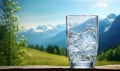 Pure drinking water is being poured into a glass on the table. Royalty Free Stock Photo