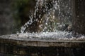 Pure fresh water waterfall in forest in the mountains. Old fontain close up Royalty Free Stock Photo