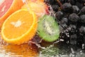 Pure fruit in a spray of water Royalty Free Stock Photo