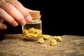 Pure gold minerals in bottles Royalty Free Stock Photo