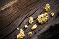 Pure gold ore on old wooden