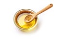 Pure Goodness: Soybean Oil in Glass Bowl with Wooden Spoon on White Background