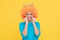 pure happiness. fancy party look. egocentric kid in clown wig and crown.