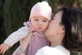 pure joy as a young Asian Chinese mother lovingly plays with her little baby girl, creating a lasting affection happiness bond - Royalty Free Stock Photo