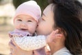 pure joy as a young Asian Chinese mother lovingly plays with her little baby girl, creating a lasting affection happiness bond - Royalty Free Stock Photo