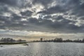 Pure lake under the sky with the sunlight behind the dark clouds