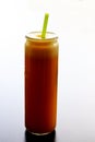 Pure orange juice in a glass with a straw Royalty Free Stock Photo