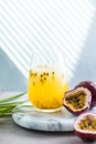 Pure passion, alcoholic cocktail with syrup, lime, orange juice, soda, ice and passion fruit Royalty Free Stock Photo