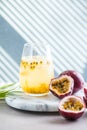 Pure passion, alcoholic cocktail with syrup, lime, orange juice, soda, ice and passion fruit Royalty Free Stock Photo