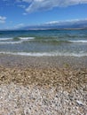 Pebble secluded beach, before the summer