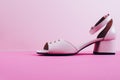 Pink woman shoes on heelson pink background Royalty Free Stock Photo