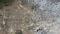 pure real spring water flowing from rocks. close up.