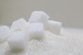 Pure refined sugar and sugar cubes. Sweet food ingredient, the d