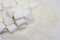 Pure refined sugar and sugar cubes. Sweet food ingredient, the d