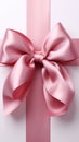 Pure sophistication white background highlights pink ribbon embellished with a graceful bow