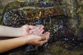 Pure spring water fills the palm of your hand Royalty Free Stock Photo