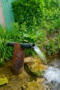 Pure water flows from the pipe Royalty Free Stock Photo